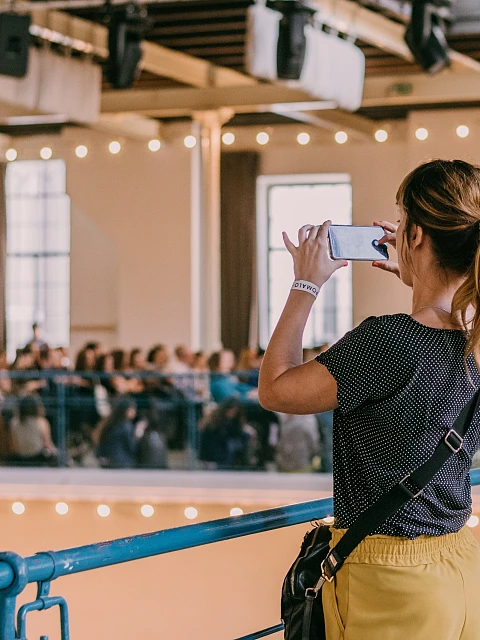 Woman taking a photo at an event